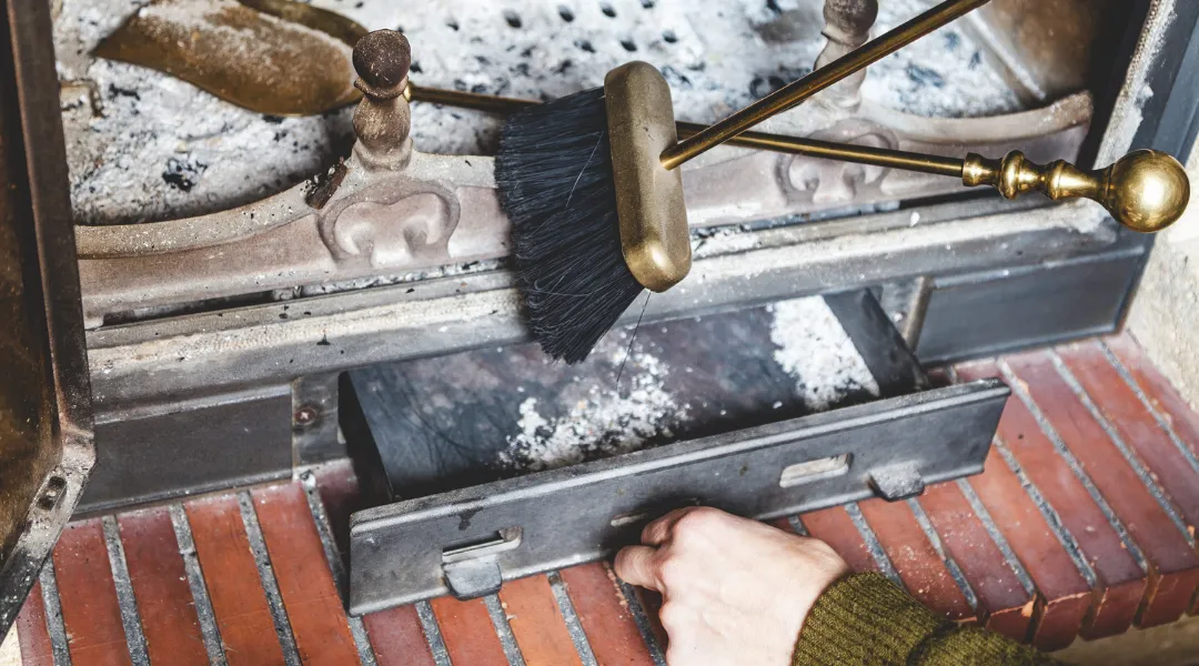 Hand pallet extinguished man opens fire with ashes. Near brass shovel and brush